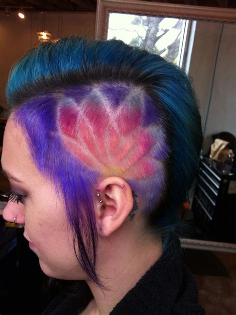 The notches cut into the sides provide a great counterpoint to the fierce, swooping mohawk itself. . Colorful undercut